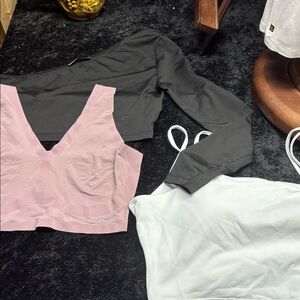 SHEIN black top, shinny girl top, as well as a white Halara.